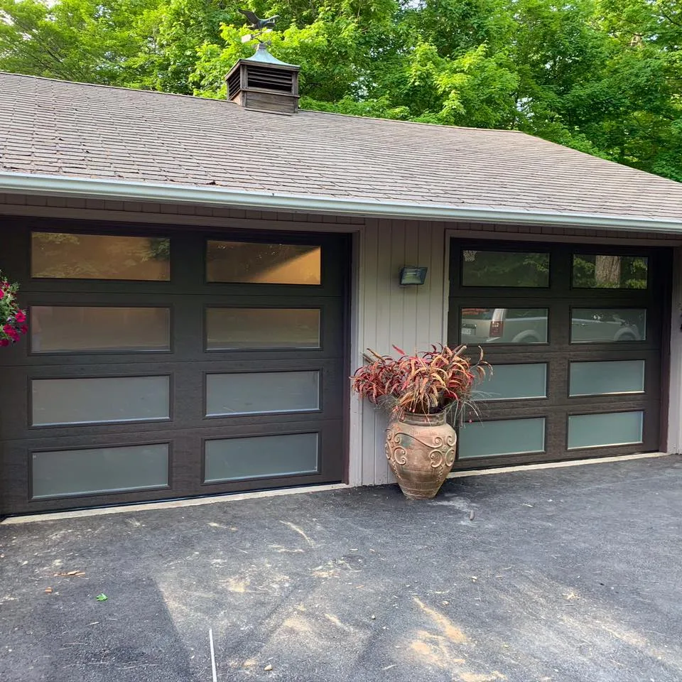 Brown textured garage door with frosted glass in each section