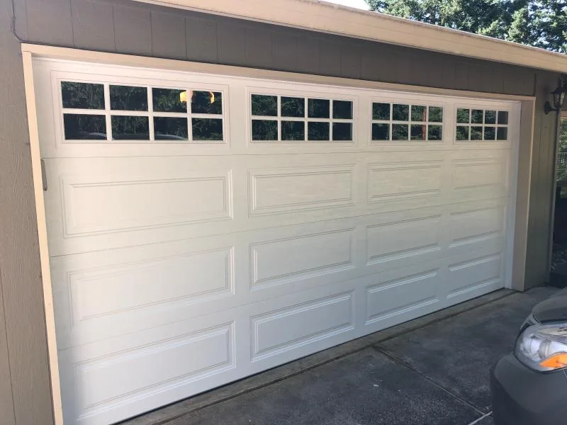 White long raised panel garage door with windows