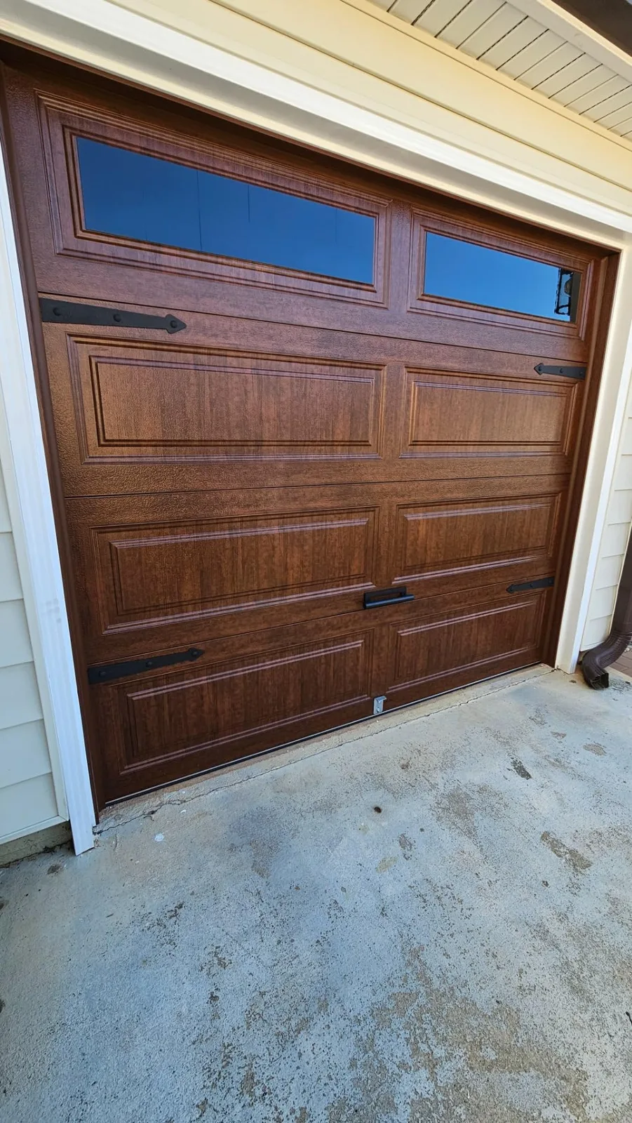 Wood-look long panel garage door with windows